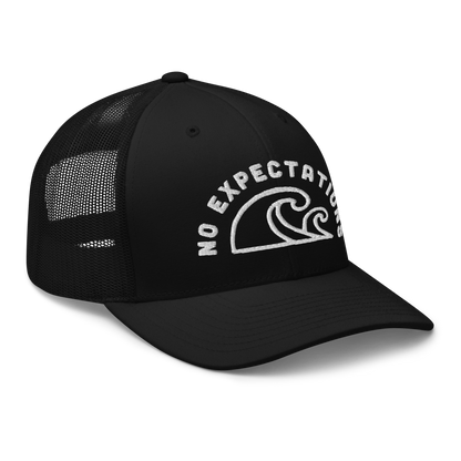 Unisex Embroidered Retro Trucker Hat featuring the No Expectations Wave logo on the front, part of the No Expectations brand collection Black