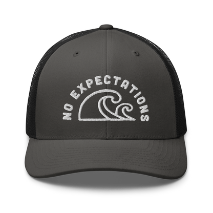 Unisex Embroidered Retro Trucker Hat featuring the No Expectations Wave logo on the front, part of the No Expectations brand collection Charcoal