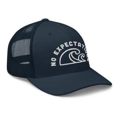 Unisex Embroidered Retro Trucker Hat featuring the No Expectations Wave logo on the front, part of the No Expectations brand collection Navy